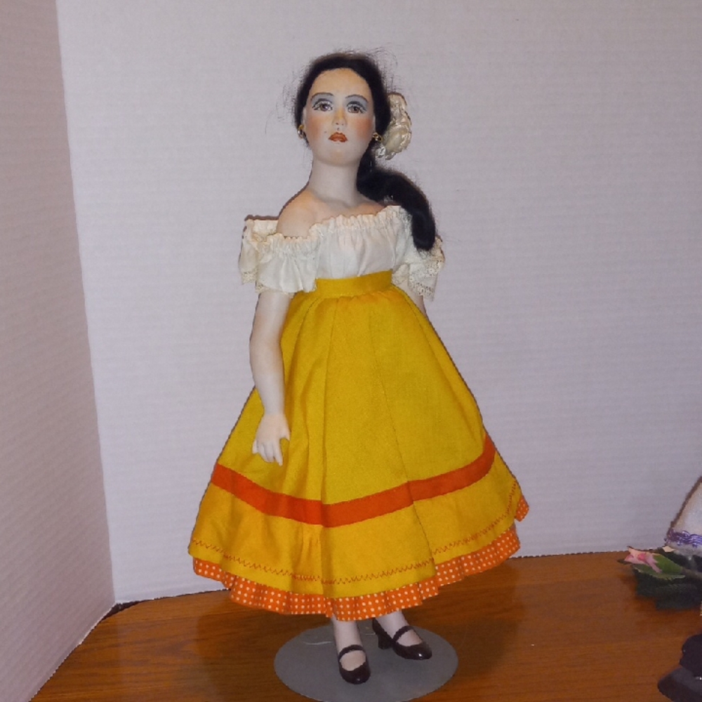 Yellow and White Porcelain Doll with Orange Accents